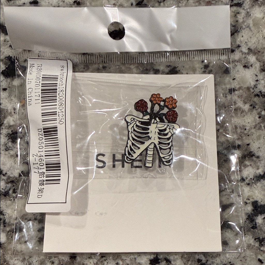 Shein Skeleton Ribcage Pin With Floral Accents 7$